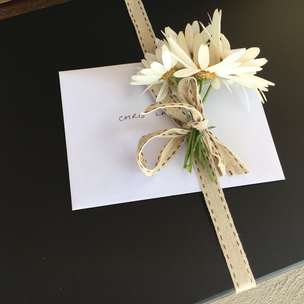 Gift Box presented with fresh flowers adn complimentary card