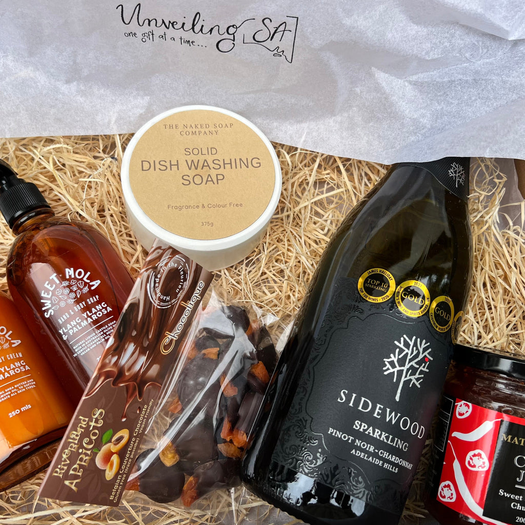 Housewarming gift box with bubbly, dish soap, hand wash and hand cream, choc apricots and chilli jam
